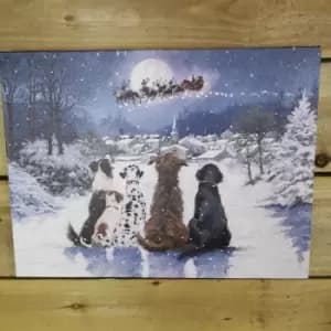 Battery Operated Fibre Optic 40x30cm Christmas Dogs Watching Santa Fly Over Village Canvas