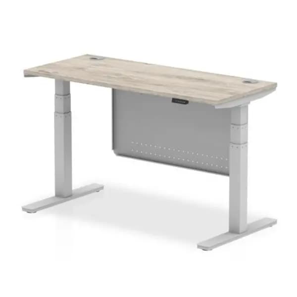 Air 1400 x 600mm Height Adjustable Desk Grey Oak Top Cable Ports Silver Leg With Silver Steel Modesty Panel