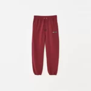 Mennace Badge Fleece Joggers - Red
