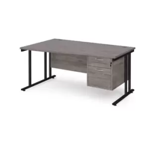 Maestro 25 left hand wave desk 1600mm wide with 2 drawer pedestal - Black cantilever leg frame and grey oak top