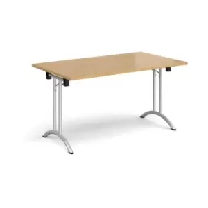 Rectangular folding leg table with silver legs and curved foot rails 1400mm x 800mm - oak