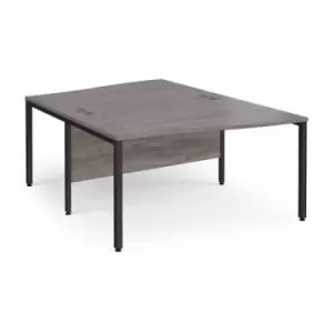 Maestro 25 back to back wave desks 1400mm deep - Black bench leg frame and grey oak top