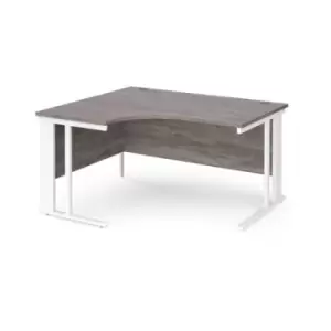 Maestro 25 left hand ergonomic desk 1400mm wide - white cable managed leg frame and grey oak top