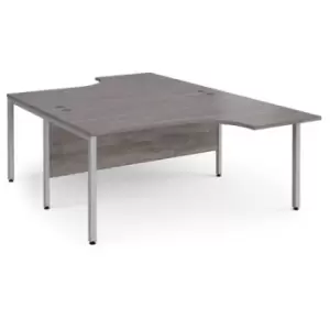 Maestro 25 back to back ergonomic desks 1600mm deep - silver bench leg frame and grey oak top