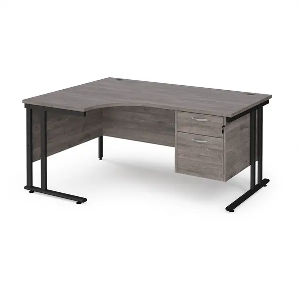 Maestro 25 left hand ergonomic desk 1600mm wide with 2 drawer pedestal - Black cantilever leg frame, grey oak top