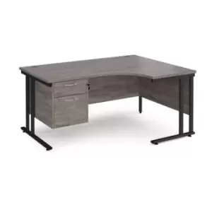 Maestro 25 right hand ergonomic desk 1600mm wide with 2 drawer pedestal - Black cantilever leg frame and grey oak top