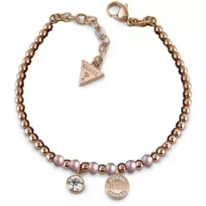 GUESS rose gold plated bead bracelet with pink Swarovski pearls, Swarovski crystal charm and logo coin charm.