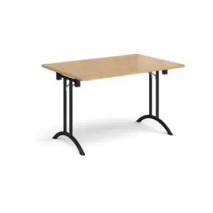 Rectangular folding leg table with Black legs and curved foot rails 1200mm x 800mm - oak